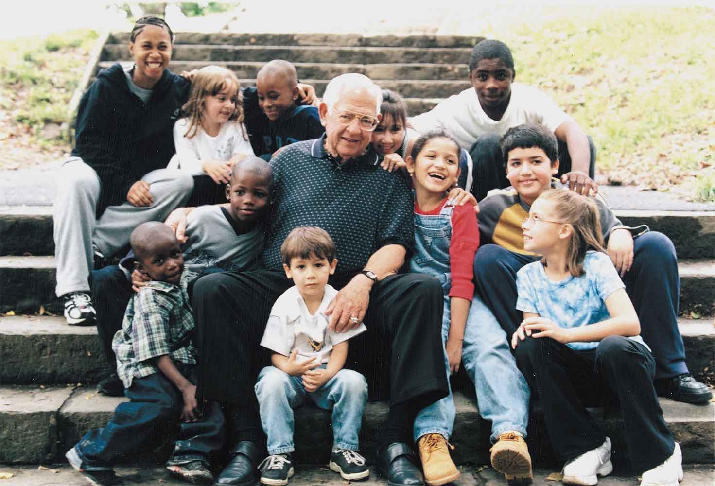 Dave Thomas with group of kids
